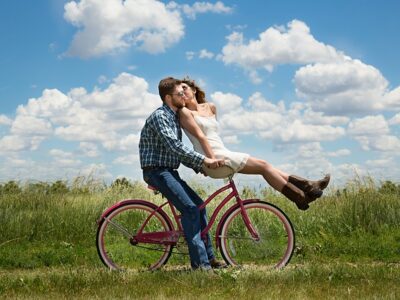 a loving couple on a bicycle