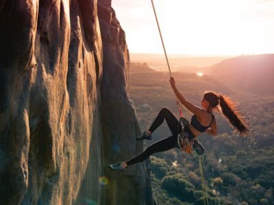 a girl climbing a mountain