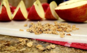 sliced apple with sprinkled granola